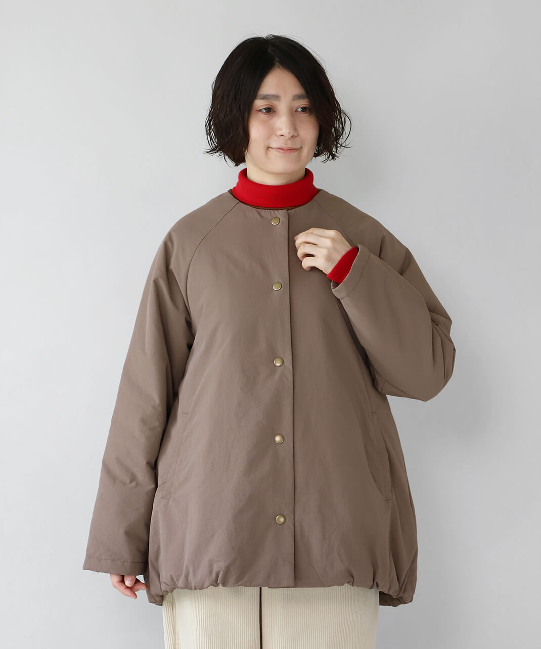 ミドル丈の中綿入りのアウター